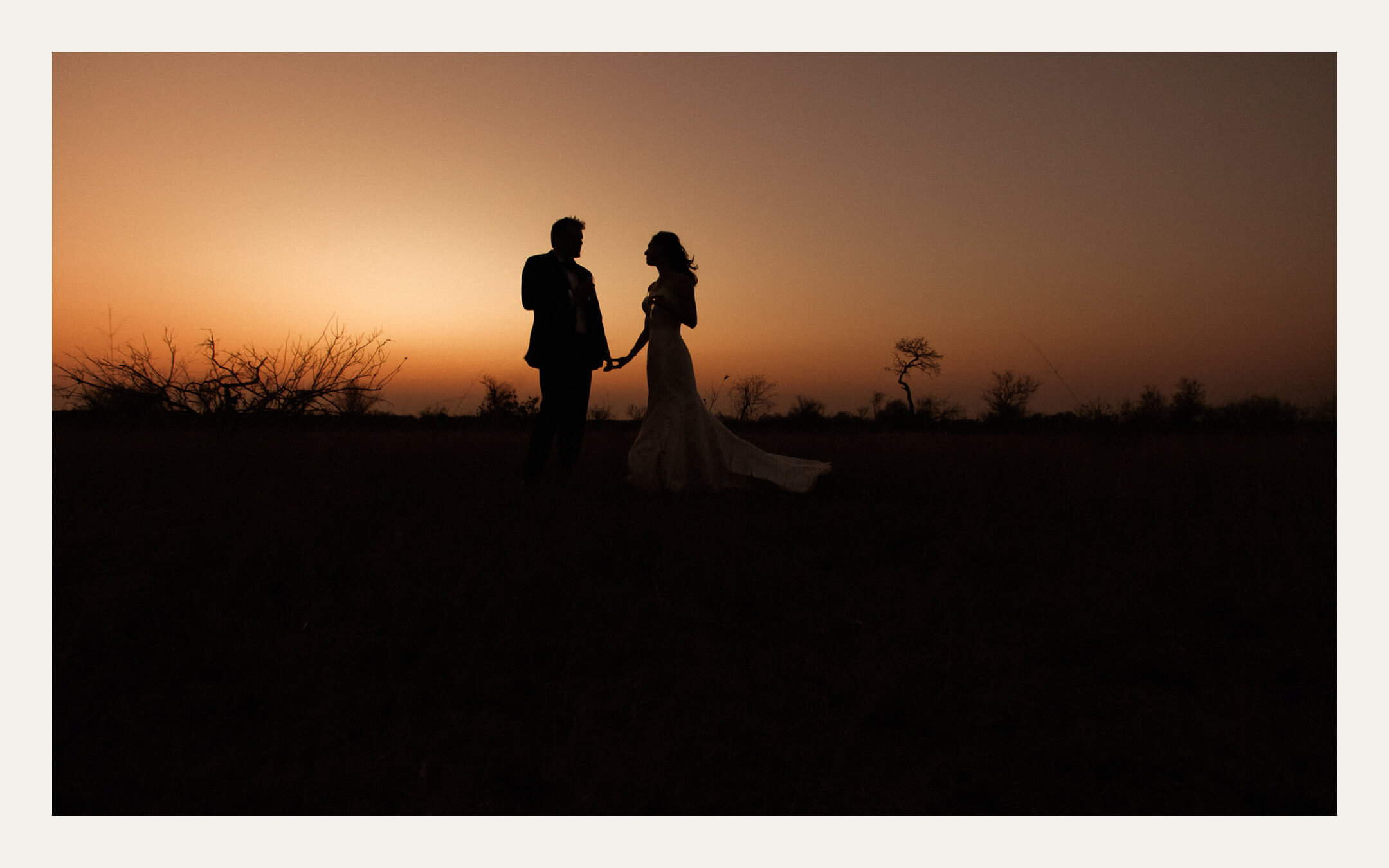 Couple silhouetted against a sunset sky — Ben Viljoen Photography